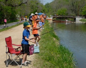 Children line the C & O canal at Fletcher's Boathouse in Washington, D.C.,