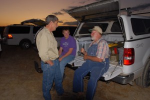 Larry Haverfield (right) talks with participants preparing for a night spotlight survey of Black-footed Ferrets on the ranch in 2009
