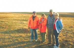 Larry and Bette Haverfield (left) stand with Gordon and Martha Barnhardt at the Black-footed Ferret reintroduction site in 2008. Note the ferret